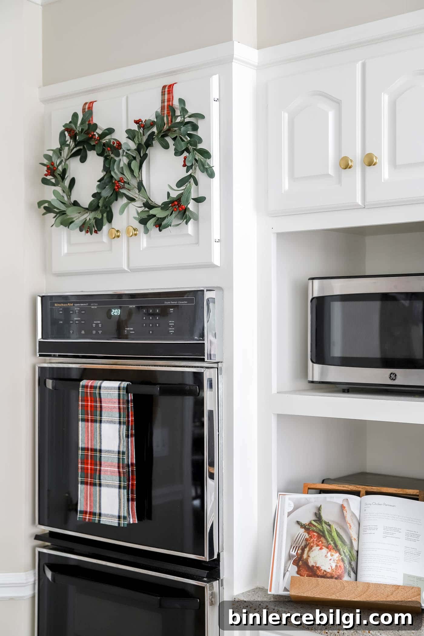2025 Christmas Decor Trends to Watch 7 Christmas kitchen with mini wreaths on cabinets