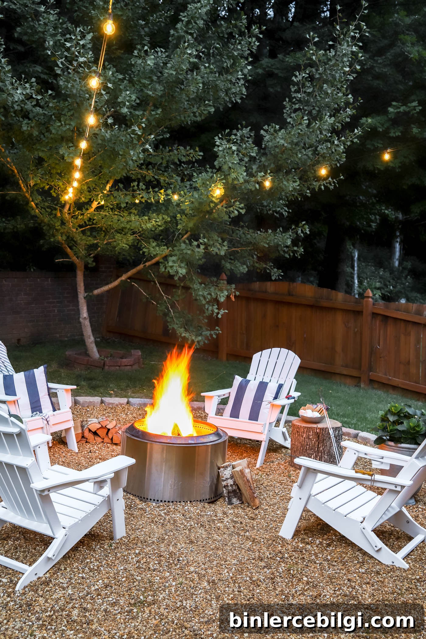 Solo stove in fire pit area with string lights.