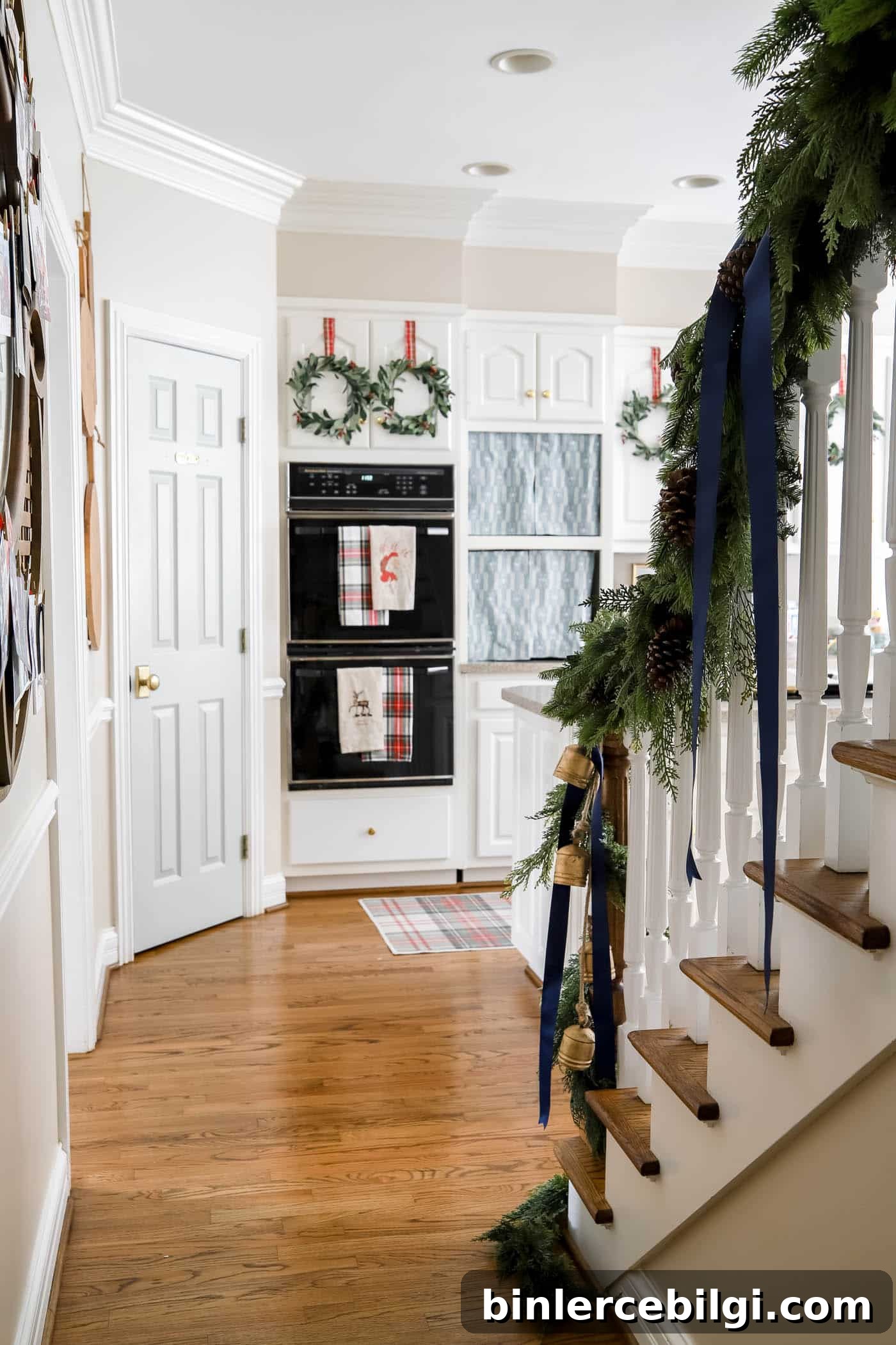 how to hang garland on the stairs.