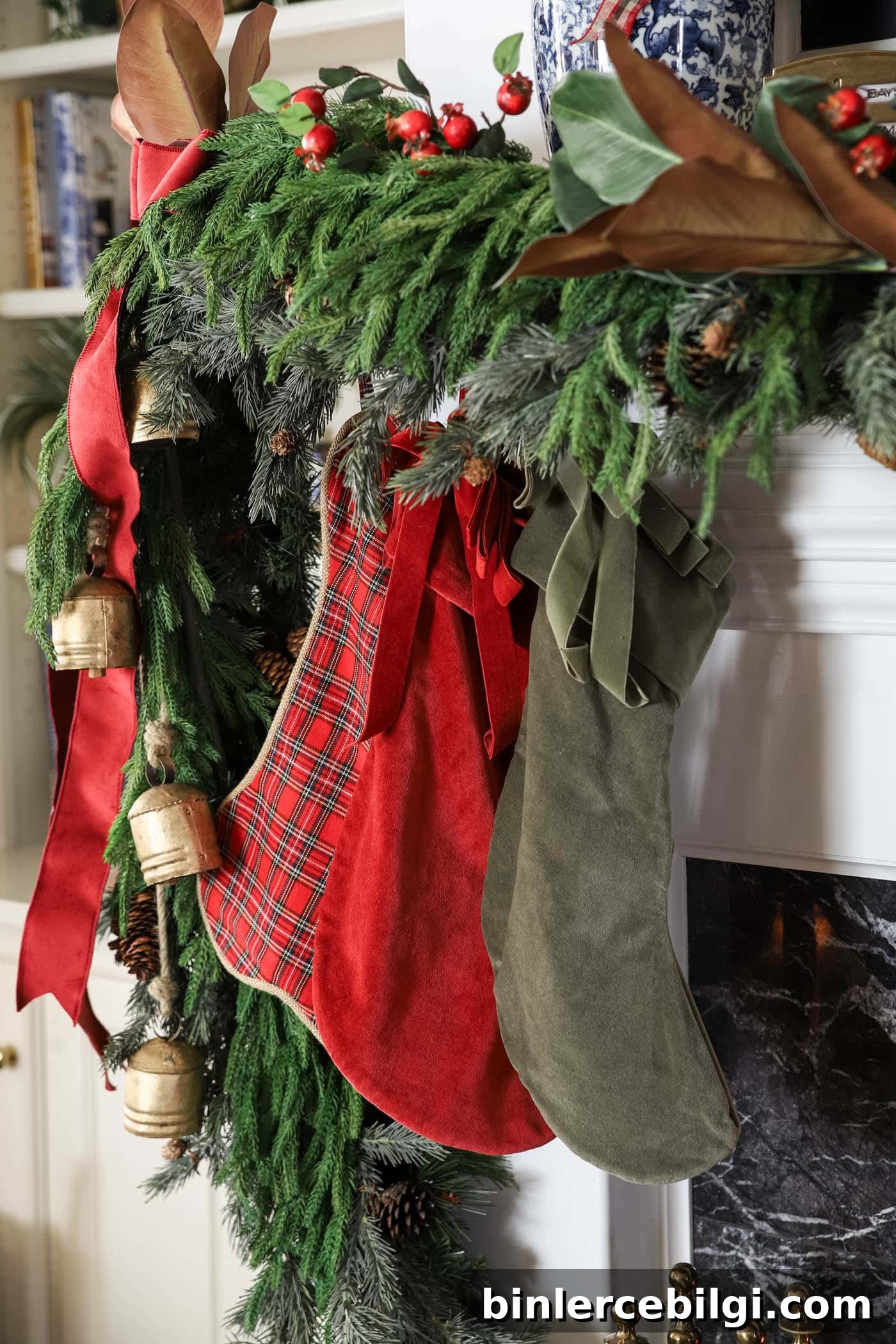 Christmas stockings with a full mantel garland.