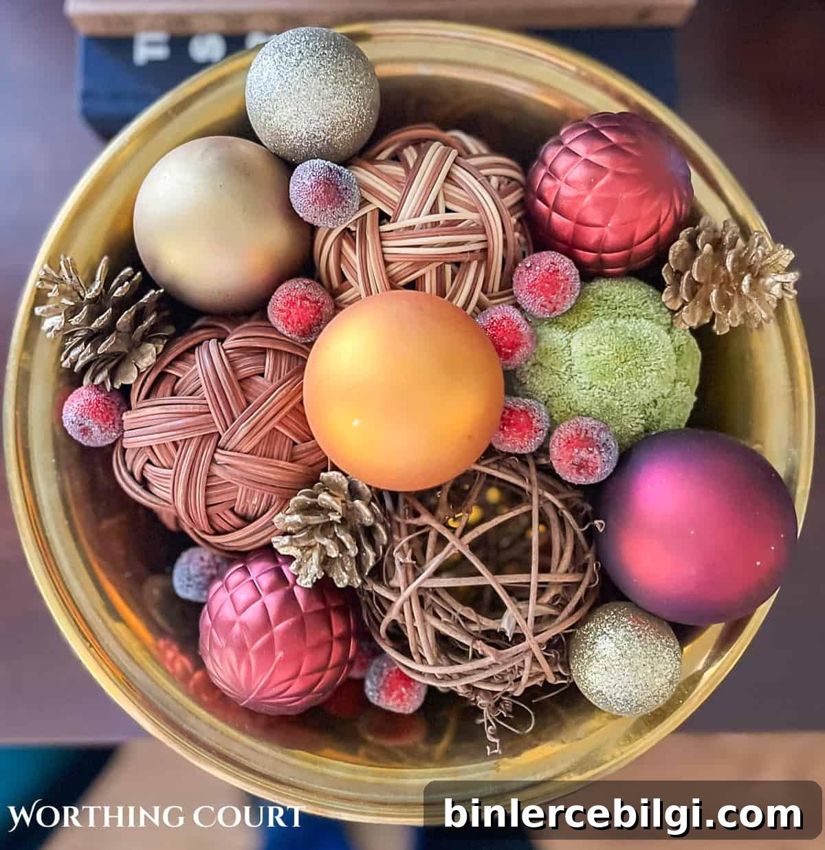 decorative bowl of christmas ornaments and other baubles. 