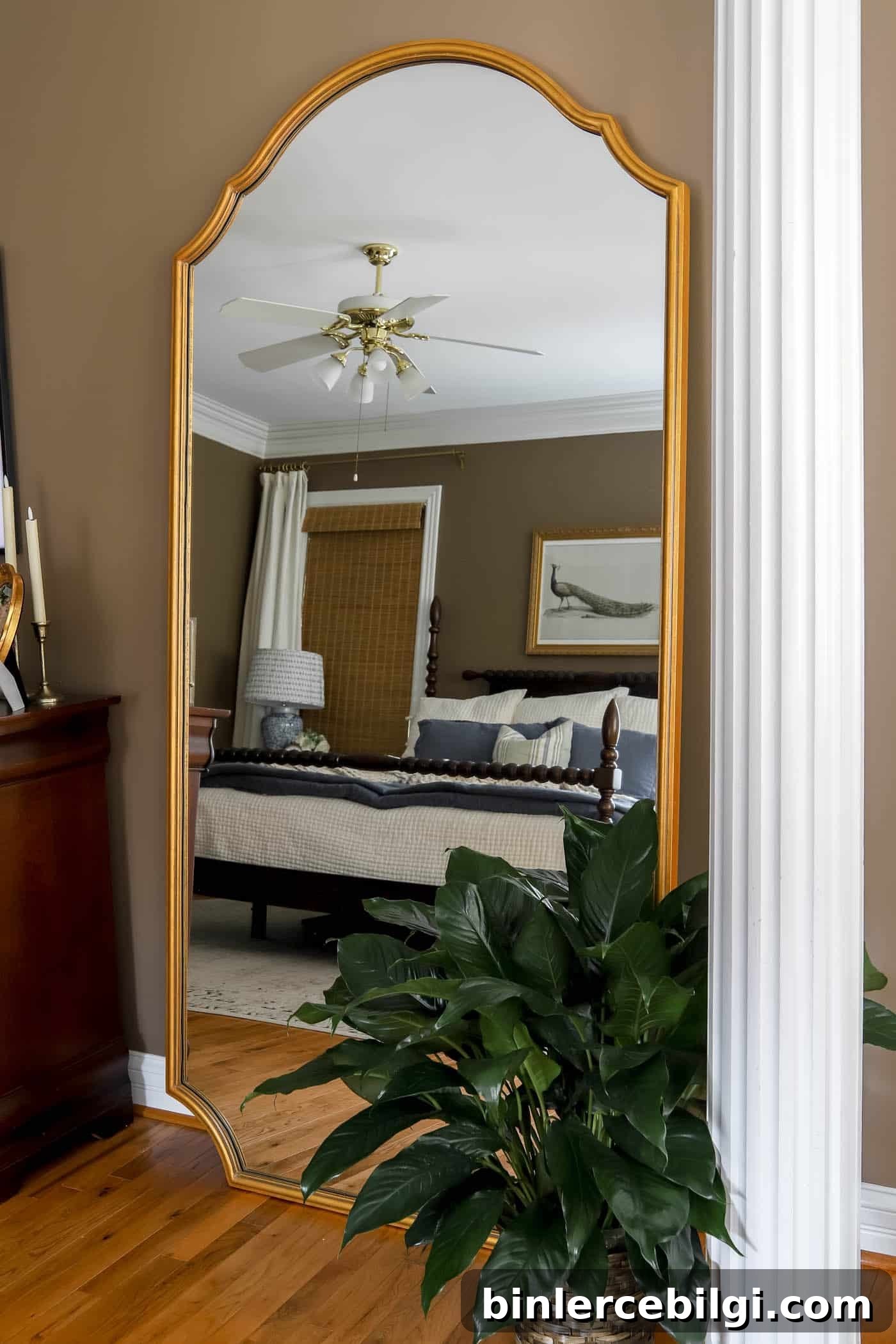 large leaning floor mirror in the bedroom.
