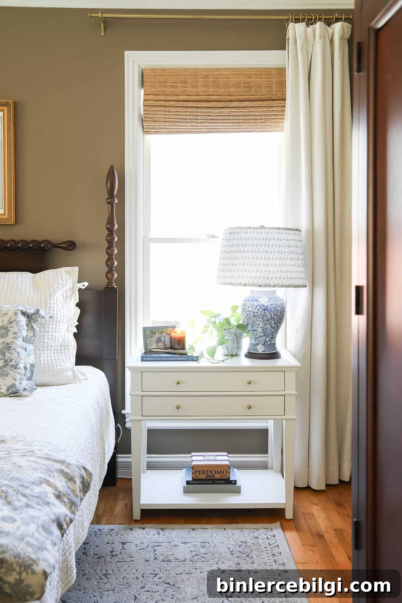 bedside table with lamp, cigar box and candle