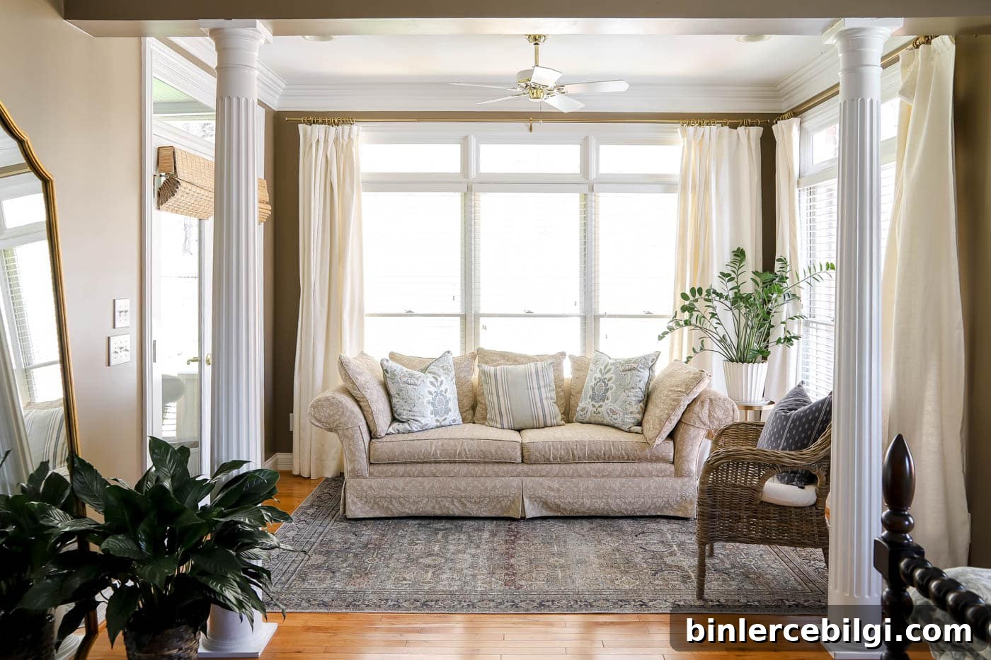 spring bedroom sitting area with floral throw pillows