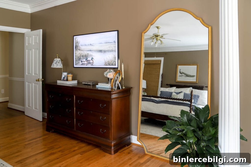 how to style a leaning mirror between a dresser and a column.