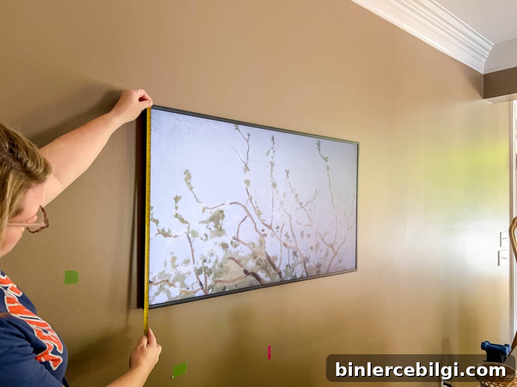 measuring the Frame TV to make a frame.