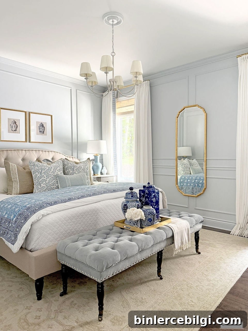 Blue and white bedroom update with gold full-length mirror