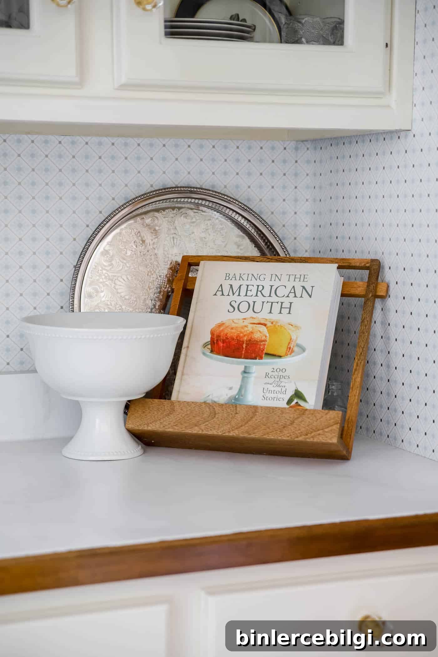 galleried silver tray stands up against the wall in a blue and white butler's pantry