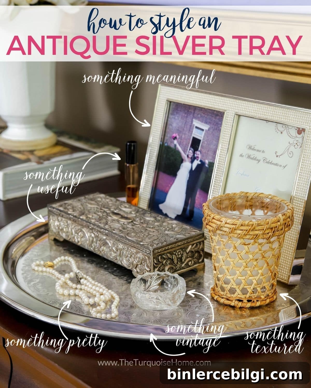 How to style an antique silver tray: silver tray on a bedroom dresser holding a framed photo, jewelry box and pearl necklaces.
