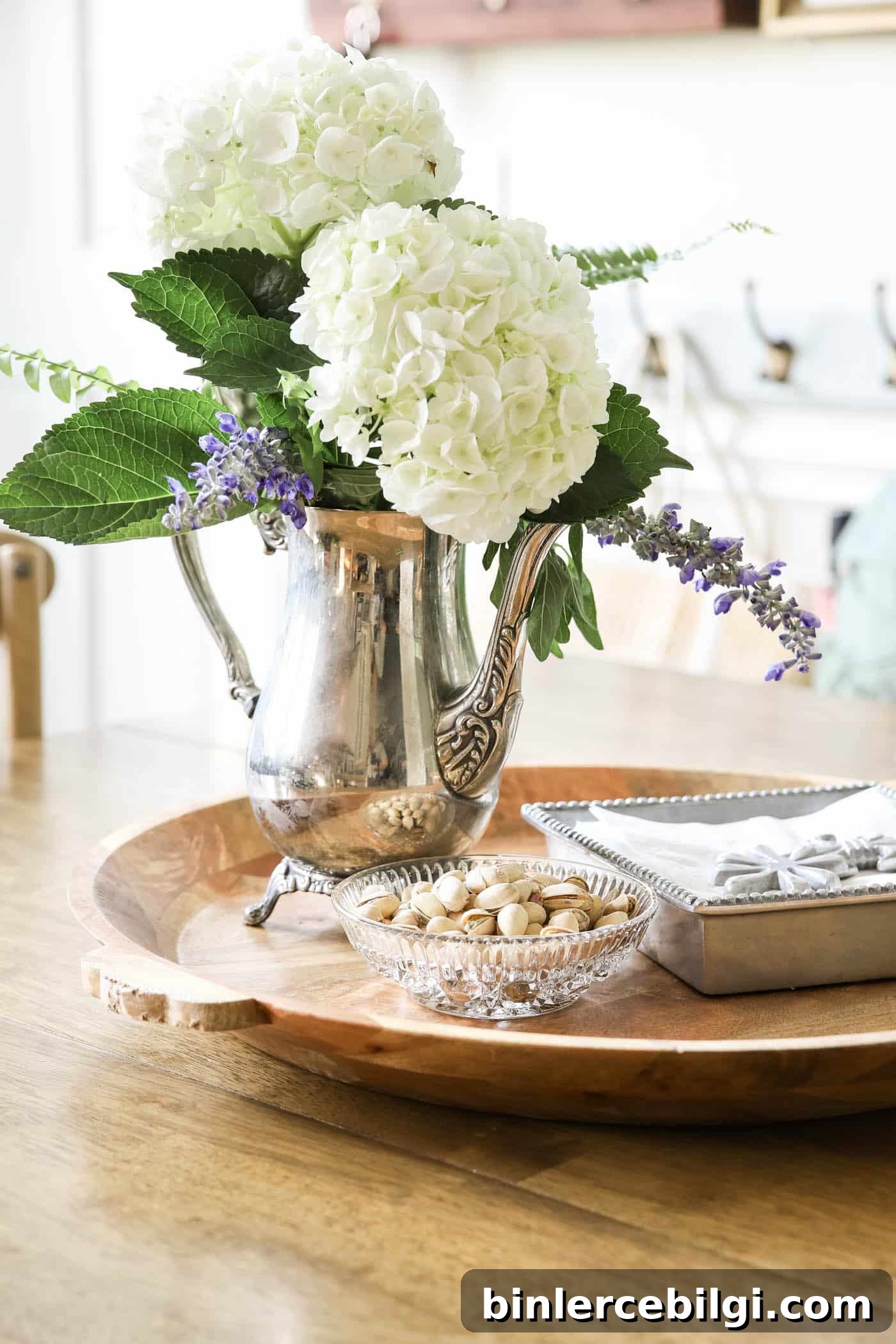 decorating with antique silver coffee pot as a vase. 