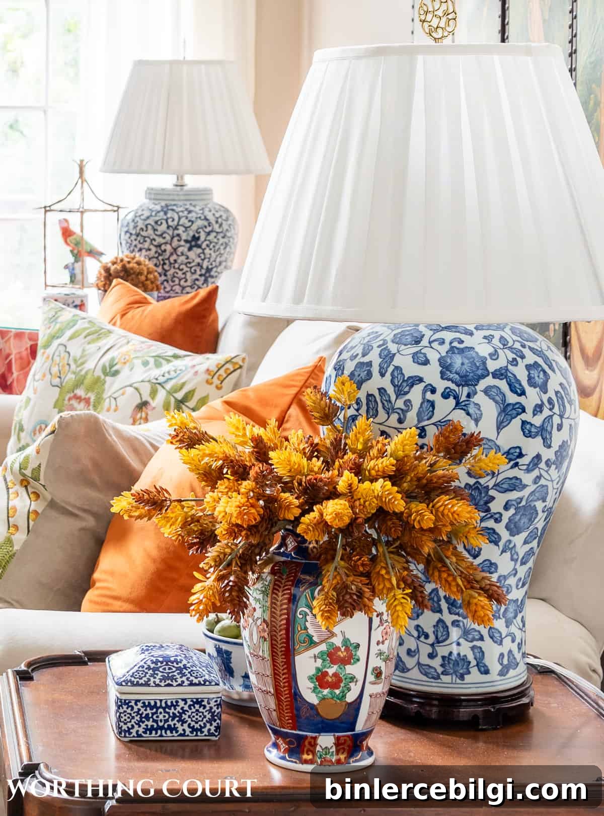 fall floral arrangement on an end table.